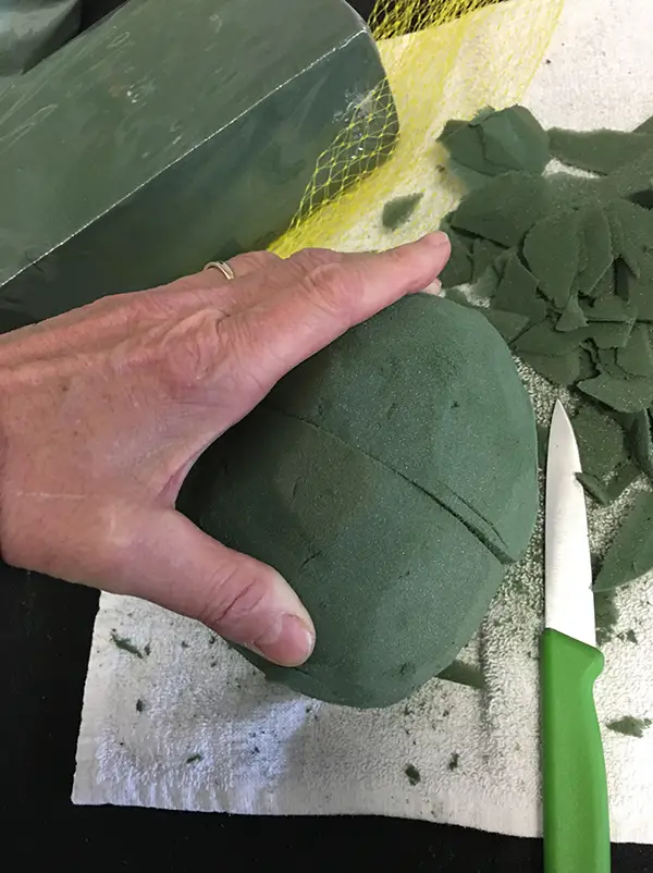 Cut pieces being sculpted into the foam ball