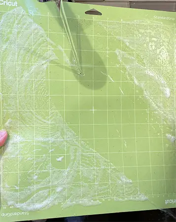 how to clean cricut cutting mats - rinse after scrubbing