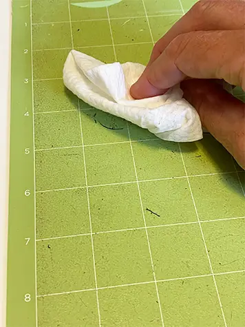 how to clean Cricut cutting mats - wipe with a baby wipe