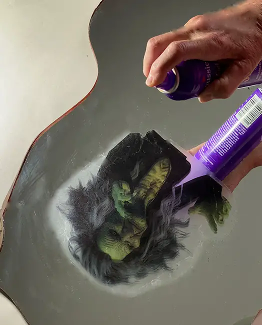 How to make a Halloween haunted mirror - apply spray 