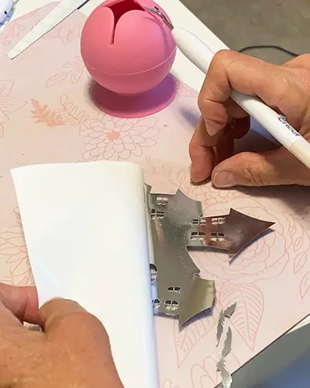 applying adhesive vinyl on wax candles - apply transfer tape