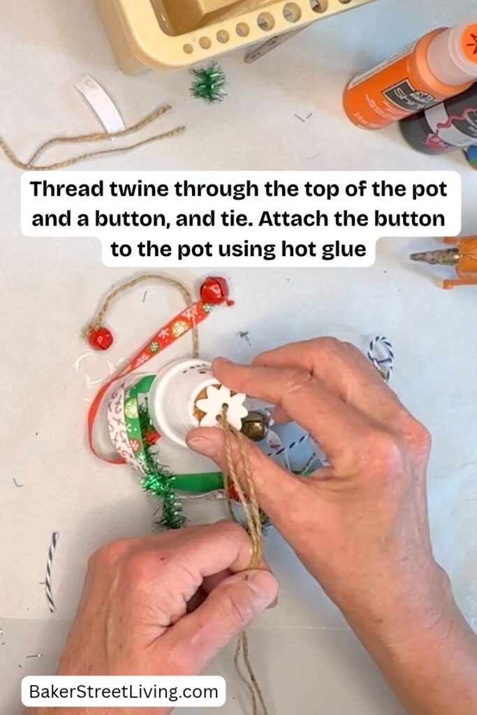 Making a DIY Snowman Tassel using a clay pot