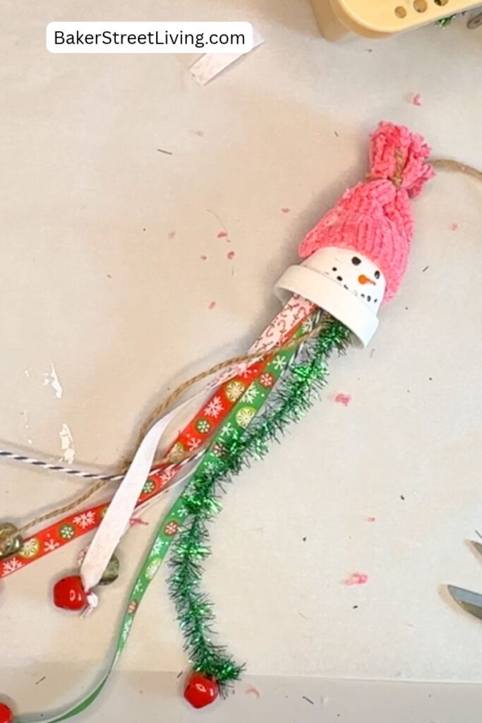 Making a DIY Snowman Tassel using a clay pot